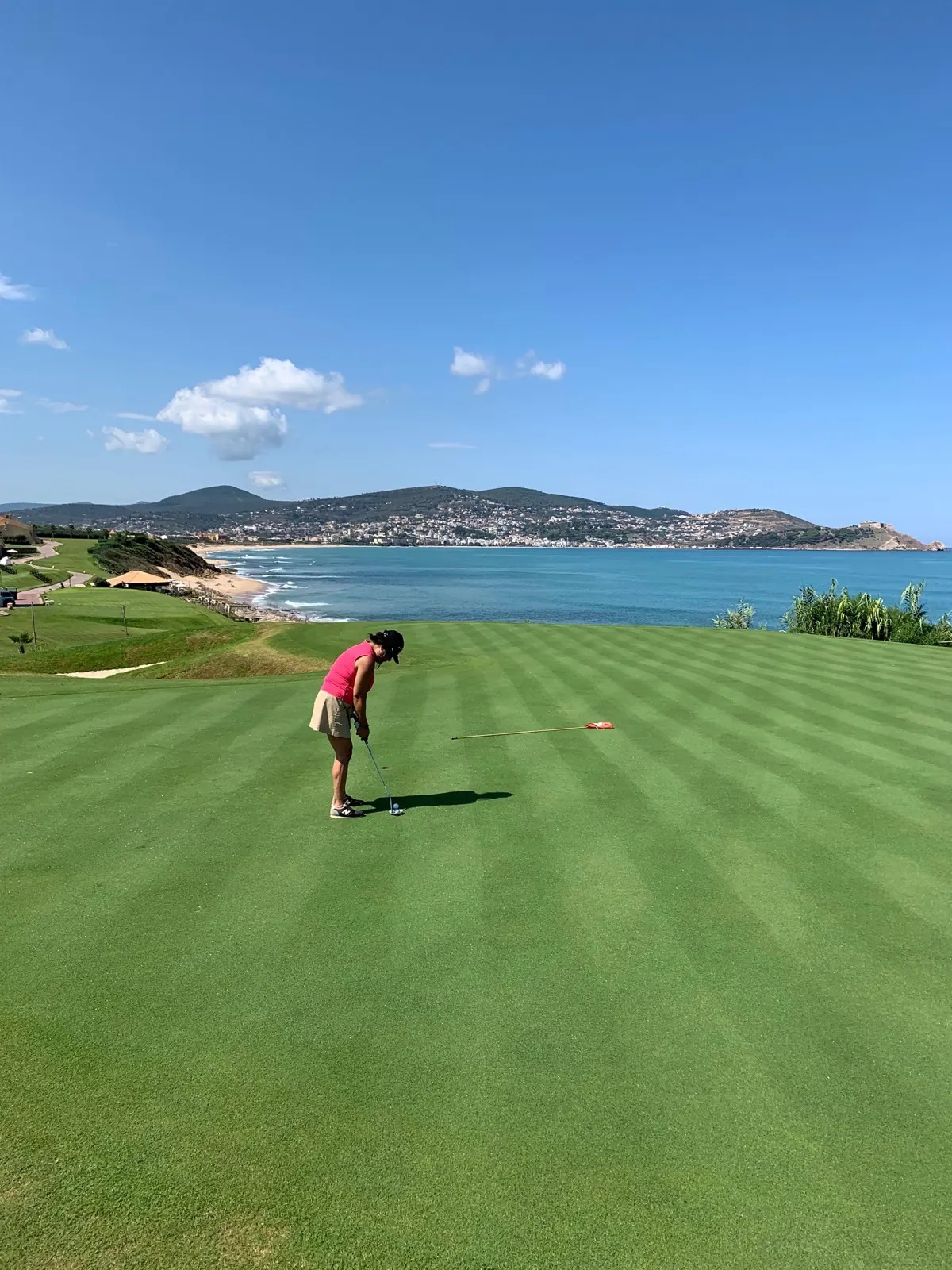 Tunisia golf holidays — golfer putting on a seaside green